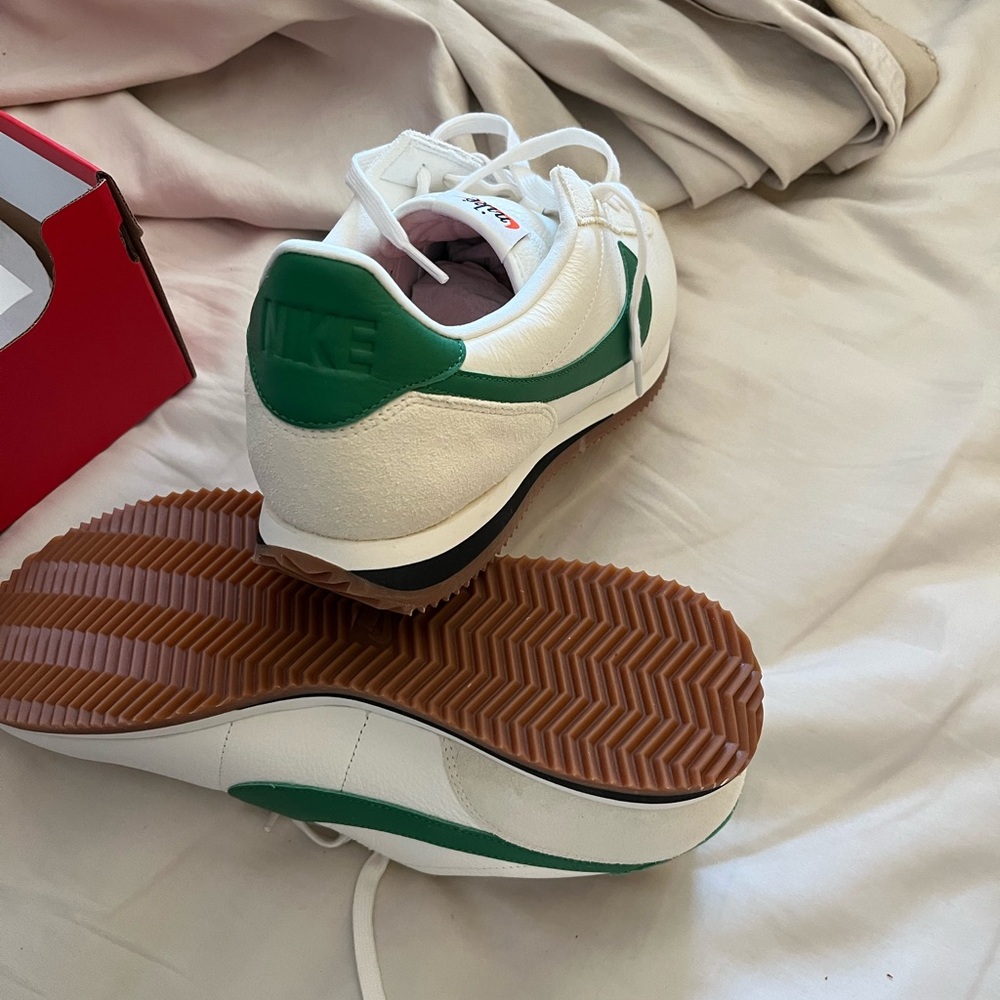 Men’s size 12 leather Nike Cortez w/green swoosh. Never worn.